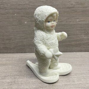 A SPECIAL DELIVERY SNOWBABY ON SNOWSHOES DELIVERS A STAR Dept 56